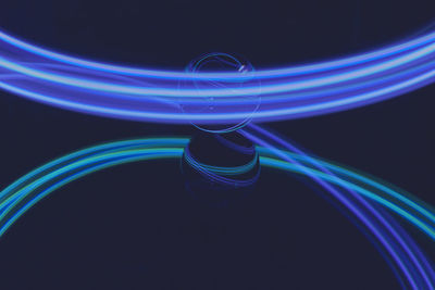 Close-up of light painting against black background