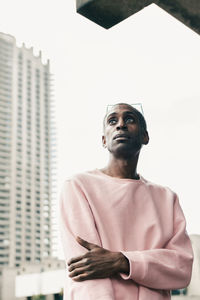 Trendy african american man walking on city street