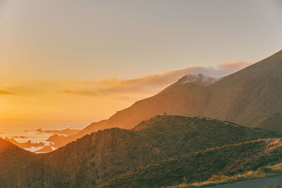 Scenic view of mountains against sky during sunset