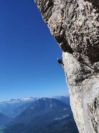 Scenic view of mountains against clear blue sky