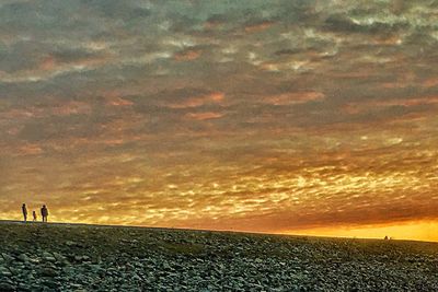 Scenic view of dramatic sky over landscape