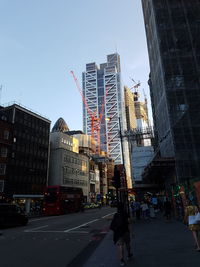 City street and buildings against sky