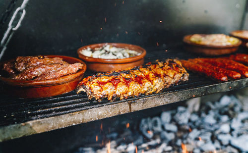 Close-up of meat on barbecue grill