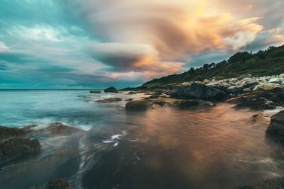 Scenic view of sea against sky during sunset