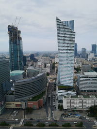 High angle view of street amidst buildings against sky