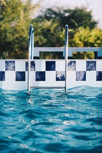 Close-up of swimming pool against trees