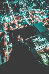 High angle view of illuminated cityscape at night