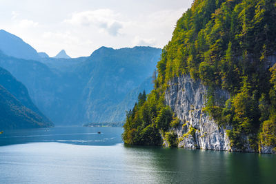 Scenic view of lake and mountains against sky