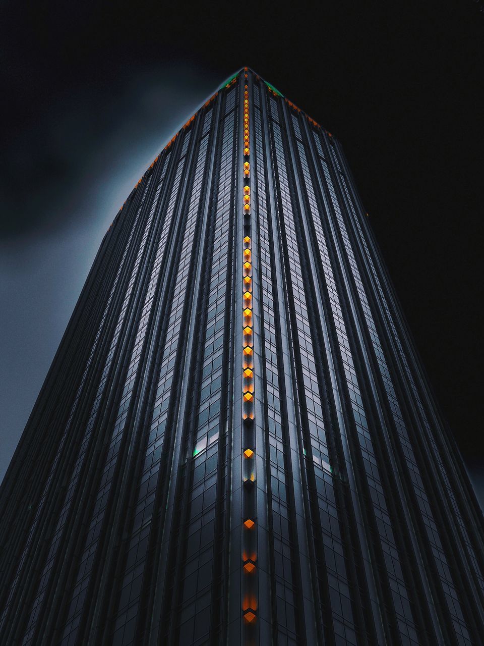 LOW ANGLE VIEW OF ILLUMINATED MODERN BUILDING