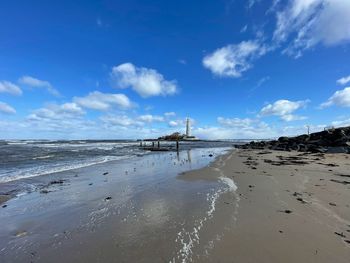 Scenic view of beach against sky