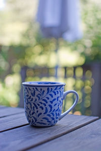 Close-up of coffee cup on table