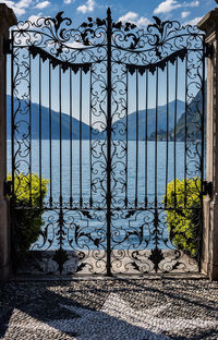 Closed gate of building against sky