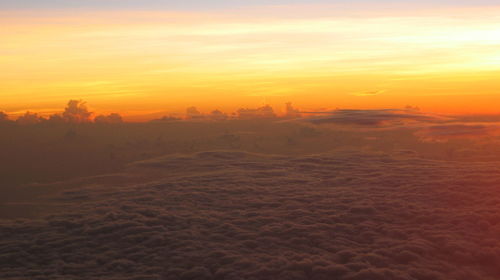Scenic view of landscape against sky during sunset