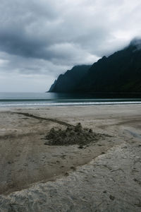 Scenic view of sandcastle at the beach against sky