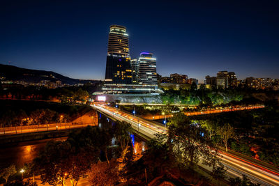 High angle view of illuminated buildings in city at night