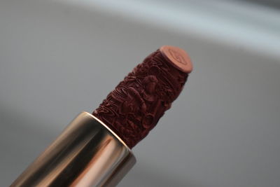Close-up of red embroiddered lipstick