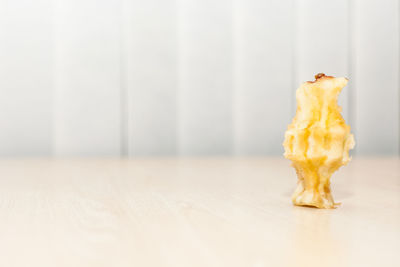 Close-up of eaten apple on table