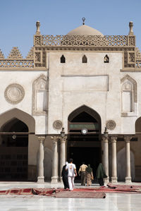 Tourists in front of building