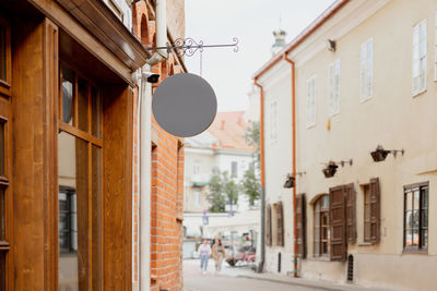 Blank signboard mock up, on the facade in old town. copy space for your store sign or logo.