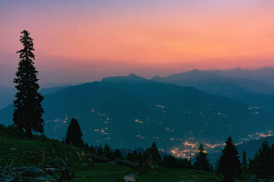 Scenic view of silhouette mountains against sky during sunset