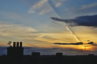 Scenic view of vapor trail in sky during sunset
