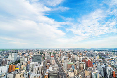 High angle view of city buildings against sky