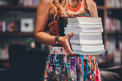 Close-up of woman reading book