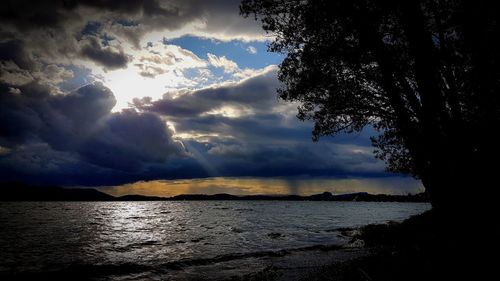 Scenic view of sea against sky at sunset