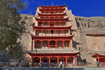 Group of people in front of ancient building