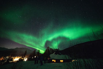 Scenic view of illuminated mountain against sky at night