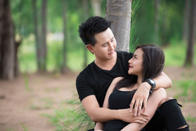 Young couple kissing on land