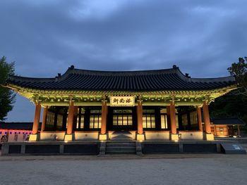 Facade of temple against building