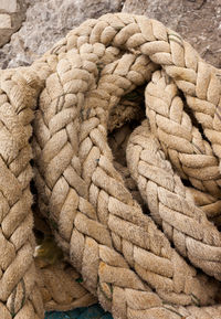 Close-up of rope tied to stone