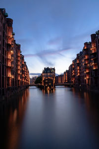 Buildings lit up at dusk