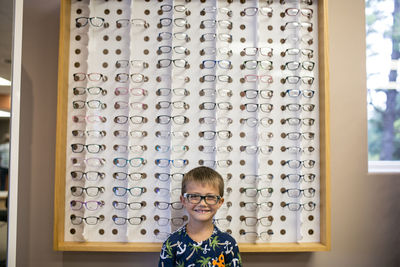 Young boy excited wearing glass in doctors office