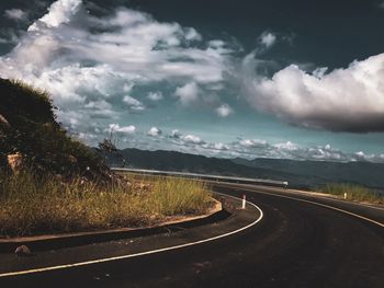 Road amidst landscape against sky