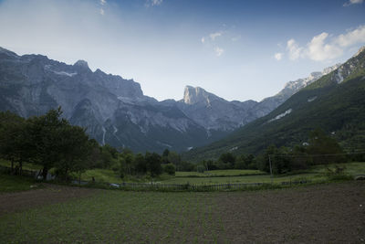 Scenic view of landscape and mountains against sky