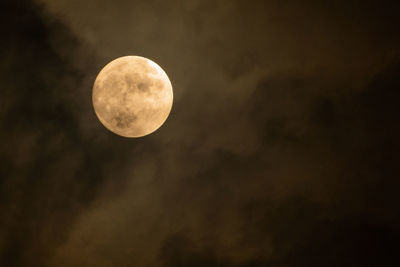 Low angle view of moon against sky at night