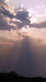 Scenic view of silhouette landscape against sky at sunset