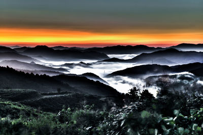 Scenic view of mountains at sunset