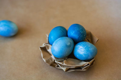 High angle view of multi colored eggs on table