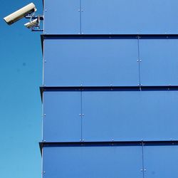 Low angle view of built structure against clear blue sky