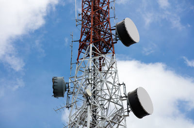 Low angle view of communications tower against sky