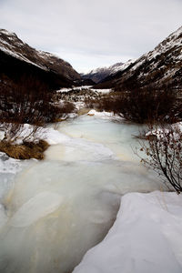 Scenic view of frozen lake against sky