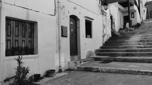 Empty alley amidst buildings in city