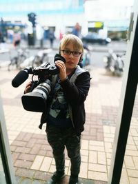 Portrait of boy photographing