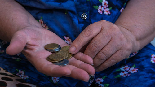 Midsection of woman holding money