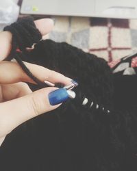 Close-up of woman hand holding umbrella