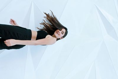 Low angle portrait of young woman