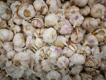 Full frame shot of garlic for sale in market